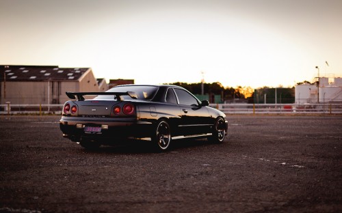 Image black coupe on road during daytime