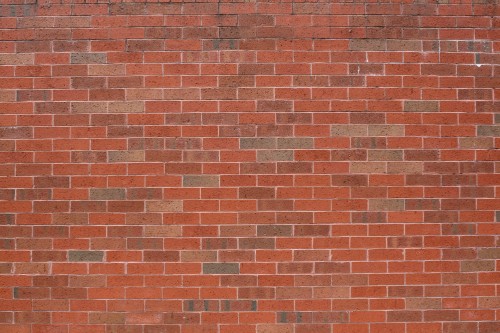 Image brown brick wall during daytime