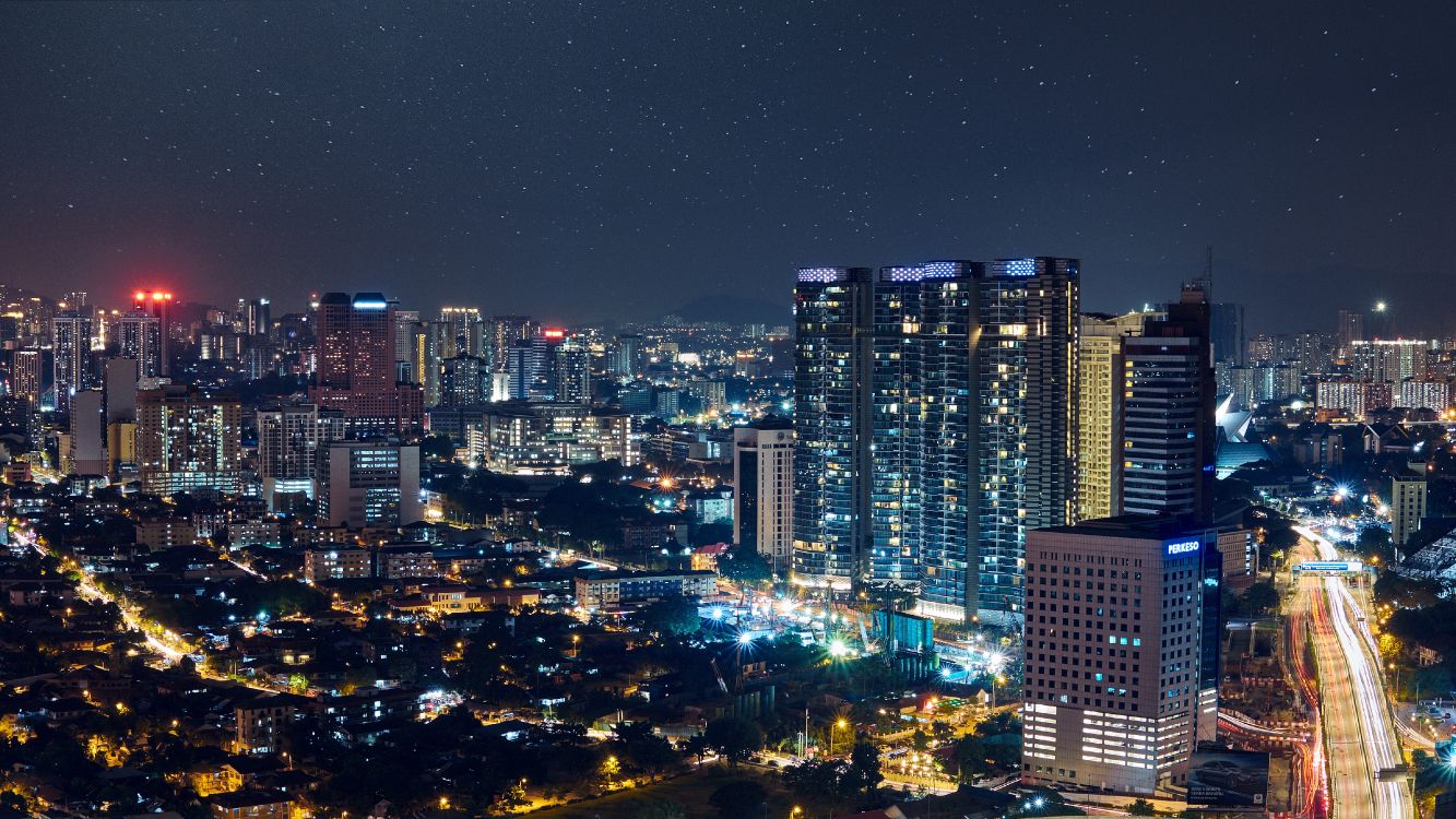 City With High Rise Buildings During Night Time. Wallpaper in 4813x2707 Resolution