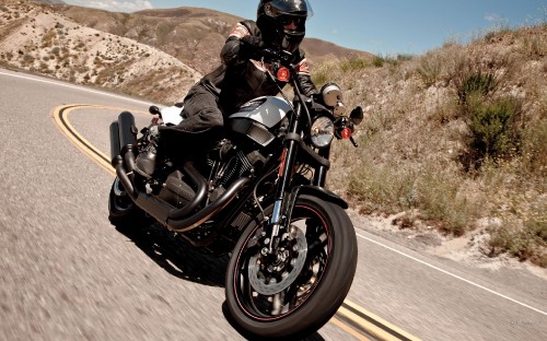 Image man in black jacket riding black motorcycle on road during daytime