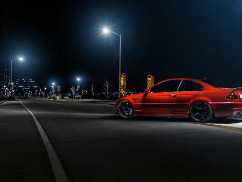 Image orange coupe on road during night time