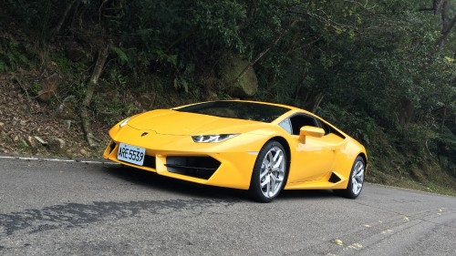 Image yellow lamborghini aventador parked on gray asphalt road