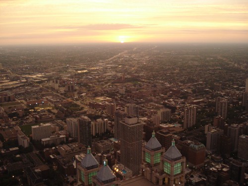 Image aerial view of city buildings during sunset