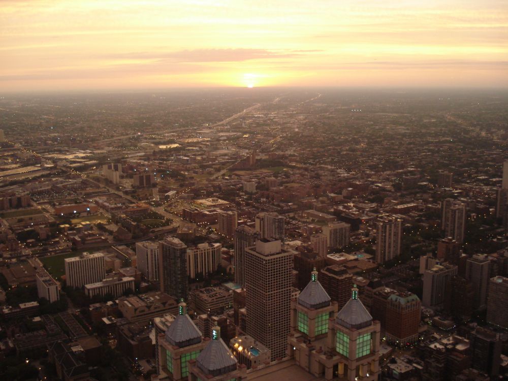 aerial view of city buildings during sunset