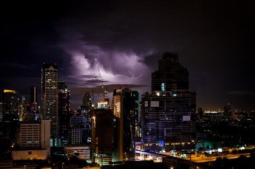 Image city with high rise buildings during night time