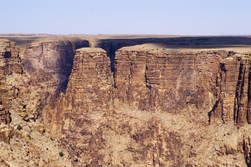 Image brown rocky mountain under blue sky during daytime