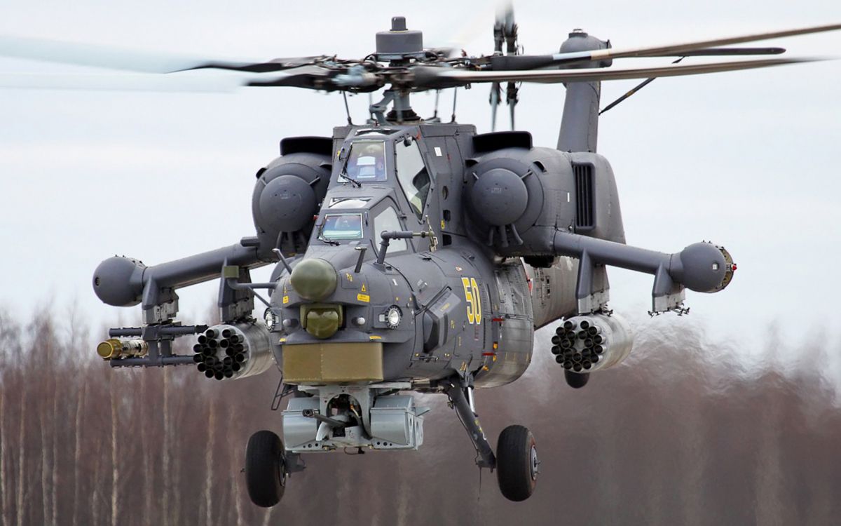 gray and yellow helicopter on brown wooden table