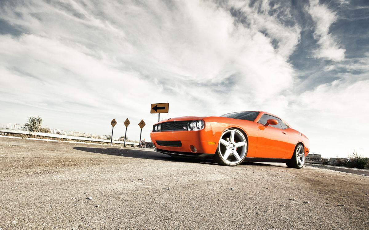Orange Porsche 911 Auf Grauer Asphaltstraße Unter Weißen Wolken Tagsüber During. Wallpaper in 2560x1600 Resolution