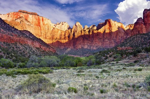 Image brown rocky mountain under cloudy sky during daytime