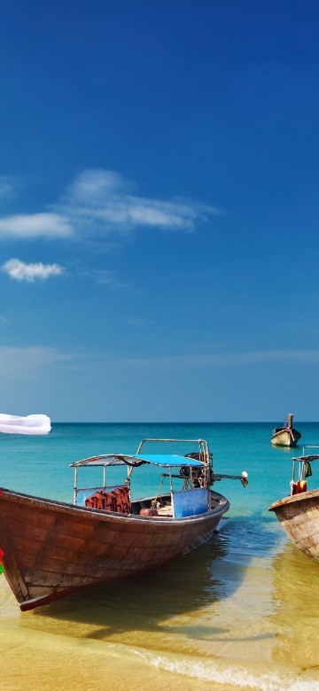 Image brown boat on sea shore during daytime