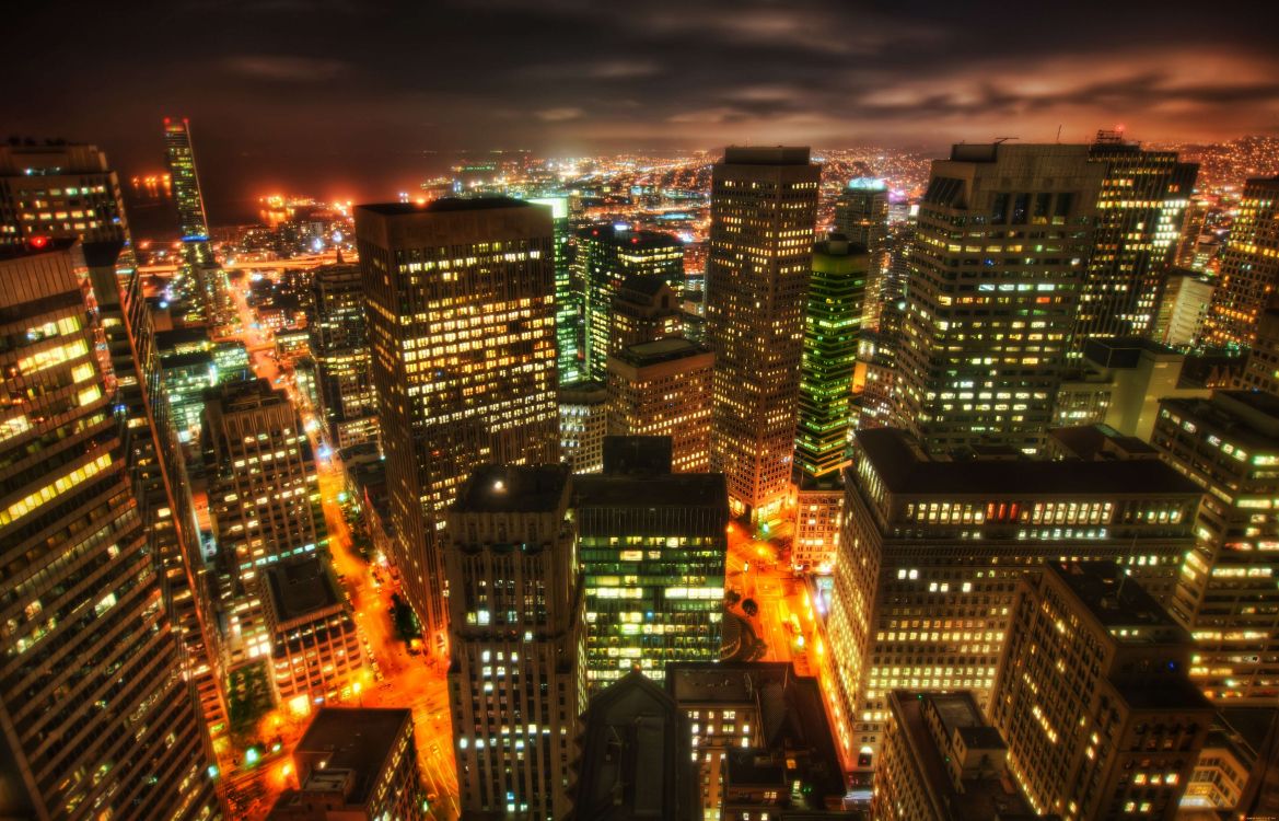 city with high rise buildings during night time