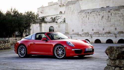 Image red ferrari 458 italia parked near gray concrete building during daytime