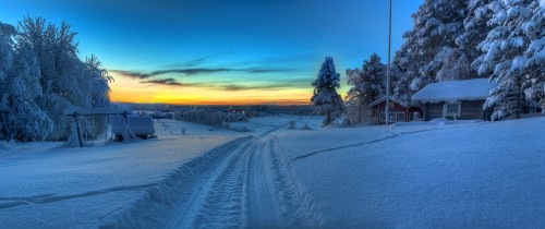 Image snow covered road during sunset