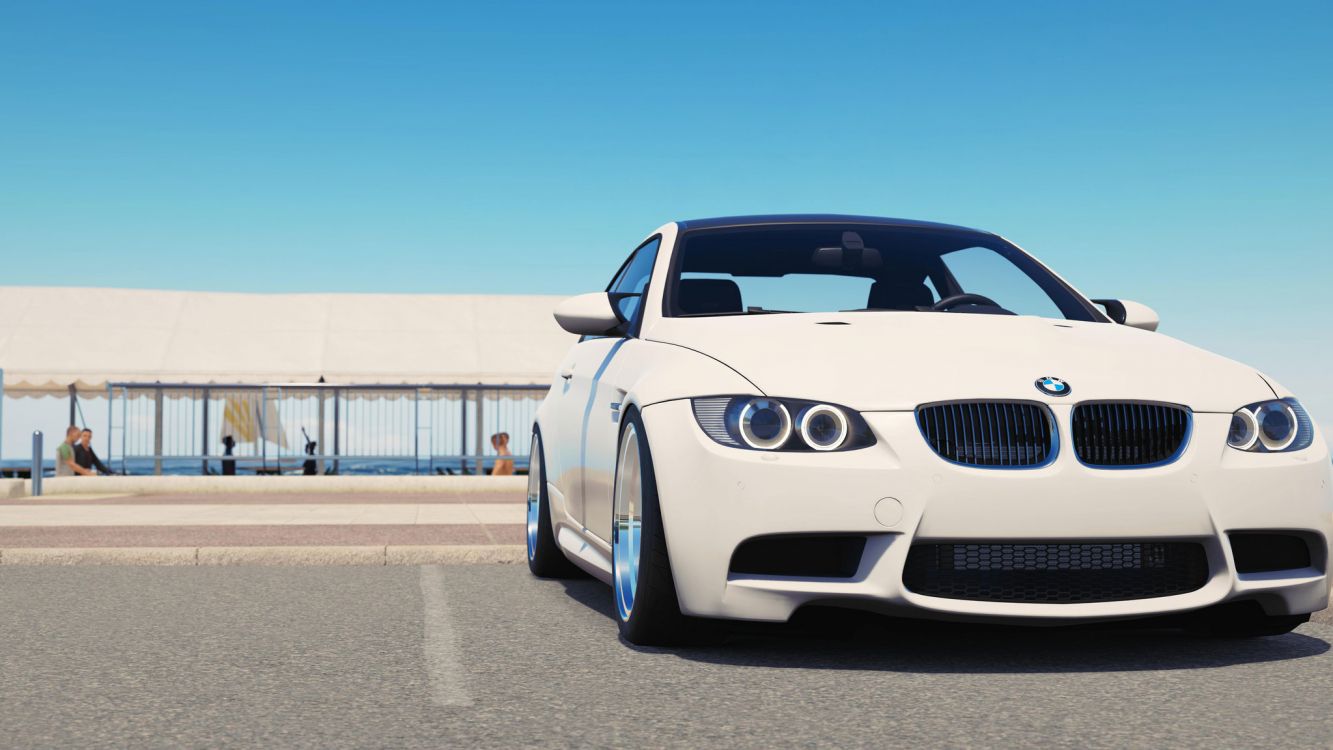 white bmw m 3 on road during daytime