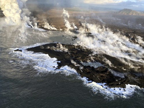 Image ocean waves crashing on rock formation during daytime