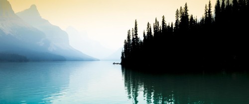 Image body of water near mountain during daytime