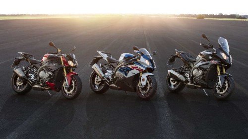 Image blue and black sports bike on gray asphalt road during daytime