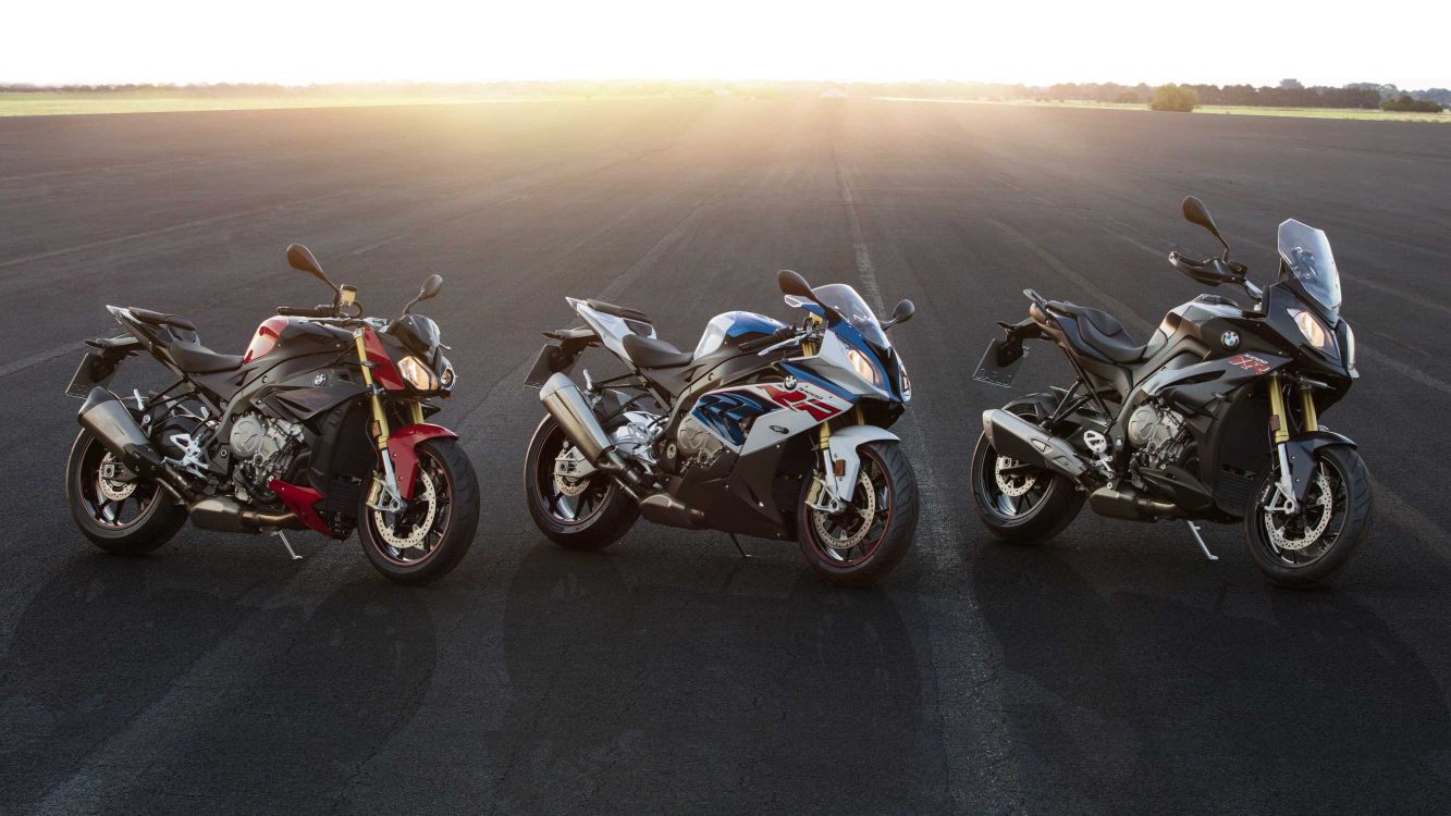 blue and black sports bike on gray asphalt road during daytime