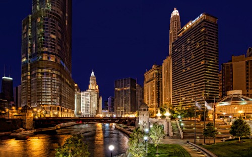 Image city buildings with lights turned on during night time