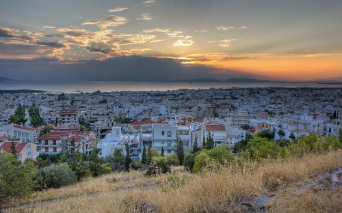 Image white and brown houses near body of water during daytime