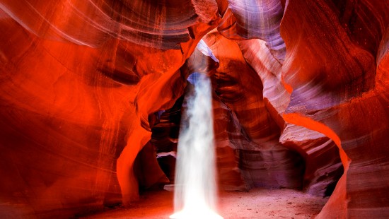 Image brown rock formation with water falls