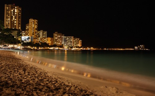 Image people on beach during night time