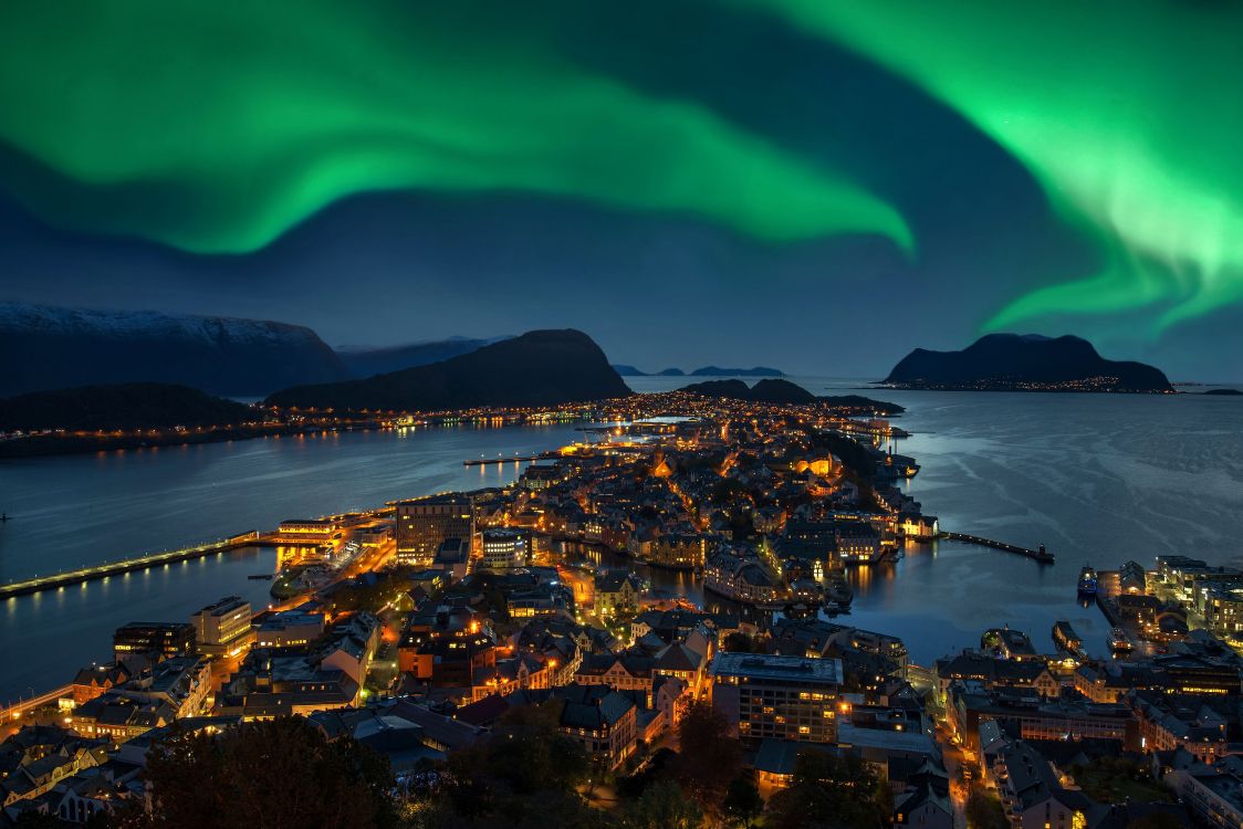 city with lights turned on during night time