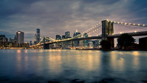 Image bridge over water during night time