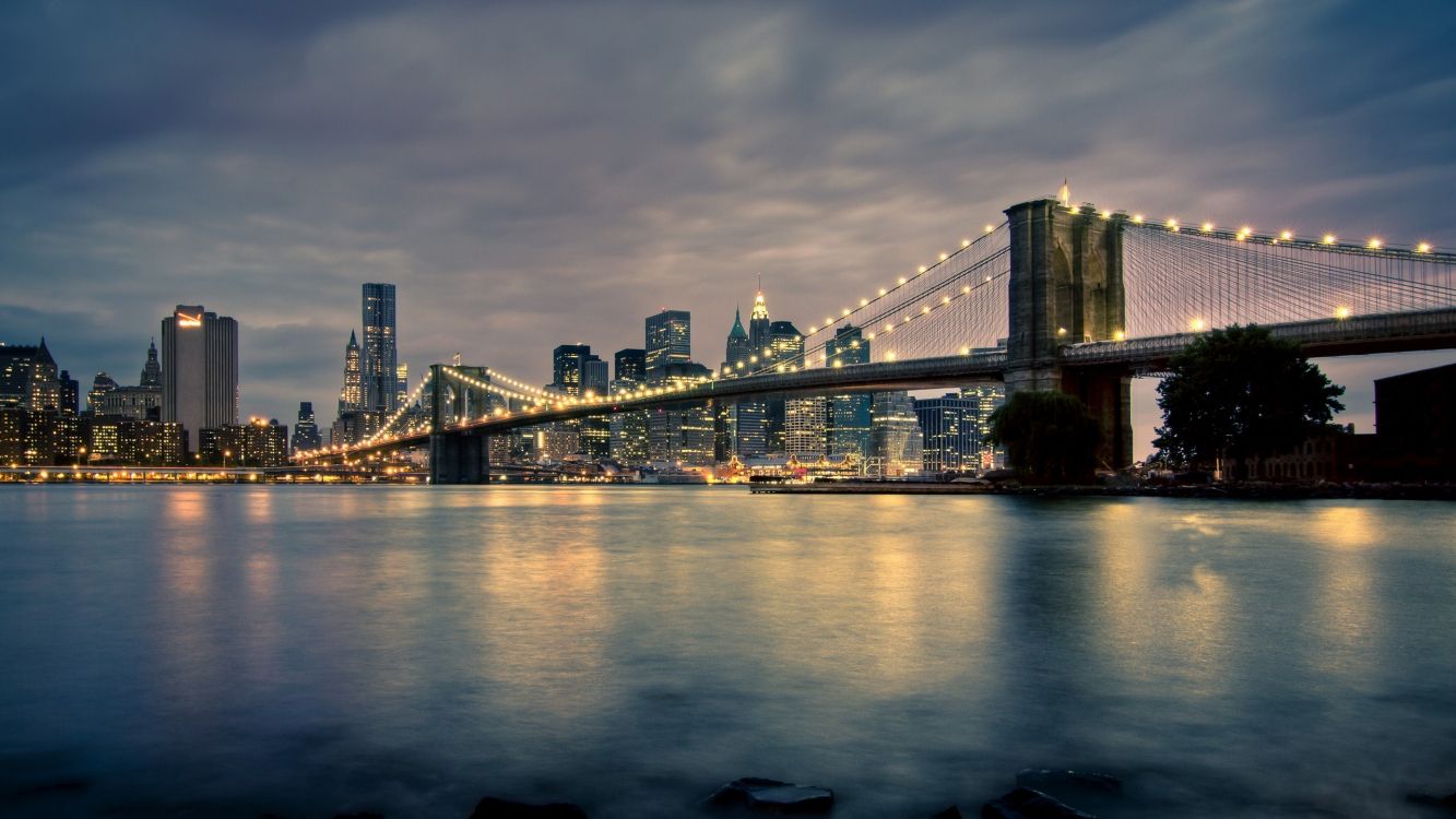 bridge over water during night time