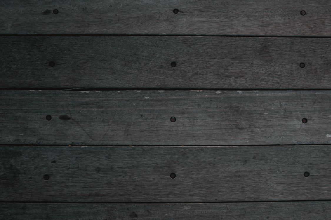 brown wooden plank in close up photography