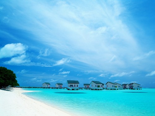 Image blue body of water under blue sky and white clouds during daytime