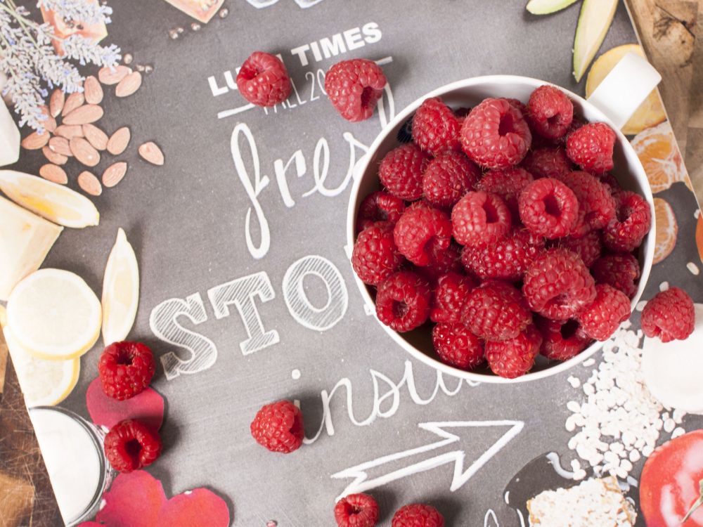 strawberries on white ceramic bowl