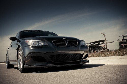 Image black bmw car on gray asphalt road during daytime