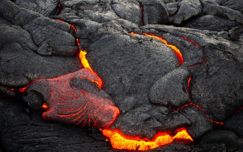 Image black and orange rock formation