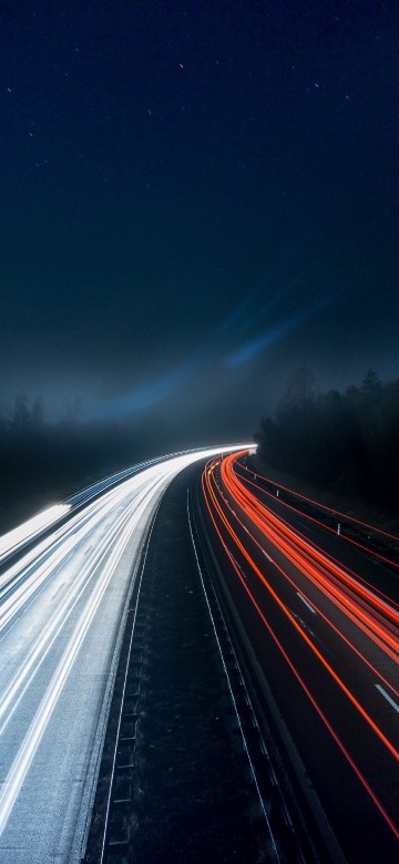 Image time lapse photography of cars on road during night time