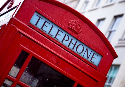 Image red telephone booth during daytime