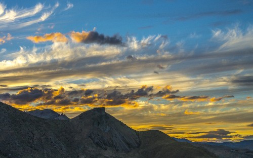 Image silhouette of mountain under cloudy sky during daytime