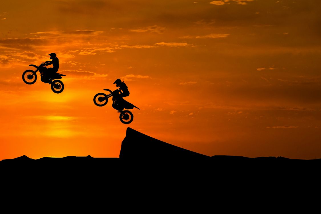 Silhouette of Man Riding Bicycle on Mountain During Sunset. Wallpaper in 4917x3278 Resolution