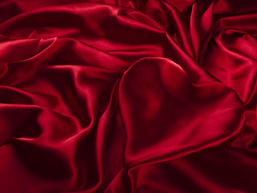 red textile on white textile