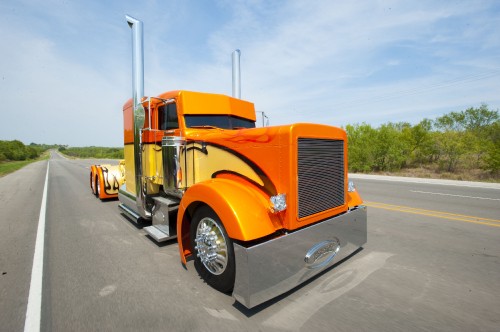 Image orange truck on road during daytime