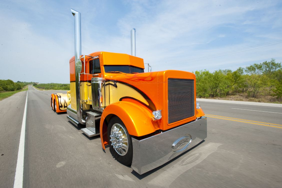 Orange Truck on Road During Daytime. Wallpaper in 4256x2832 Resolution