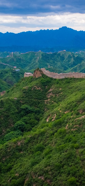 Image green grass covered mountain under blue sky during daytime