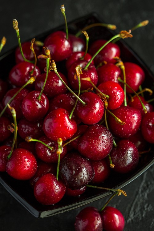 Image red cherries on stainless steel bowl