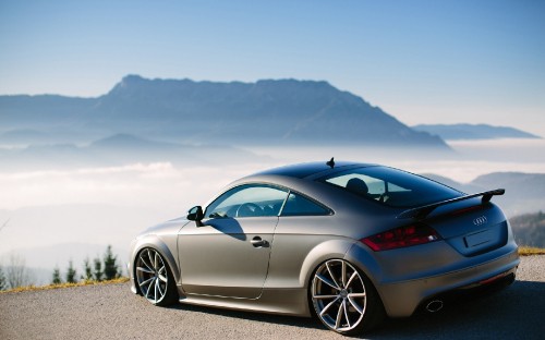 Image blue porsche 911 on gray concrete pavement