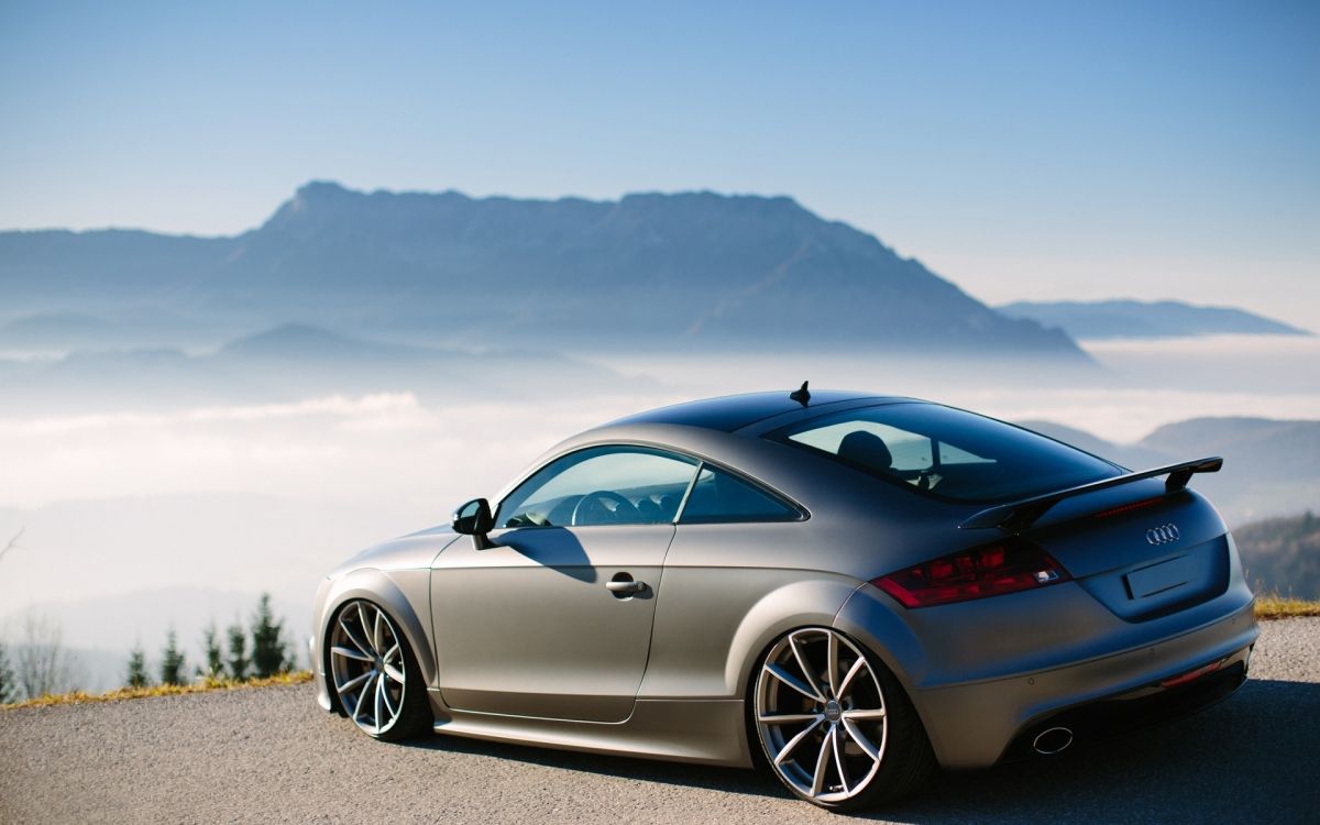 blue porsche 911 on gray concrete pavement