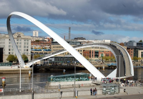 Image people walking on white bridge during daytime