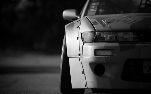 Image grayscale photo of car on road