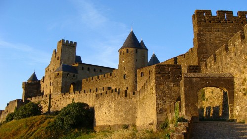 Image brown concrete castle under blue sky during daytime