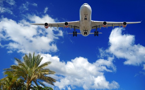 Image white airplane flying in the sky during daytime