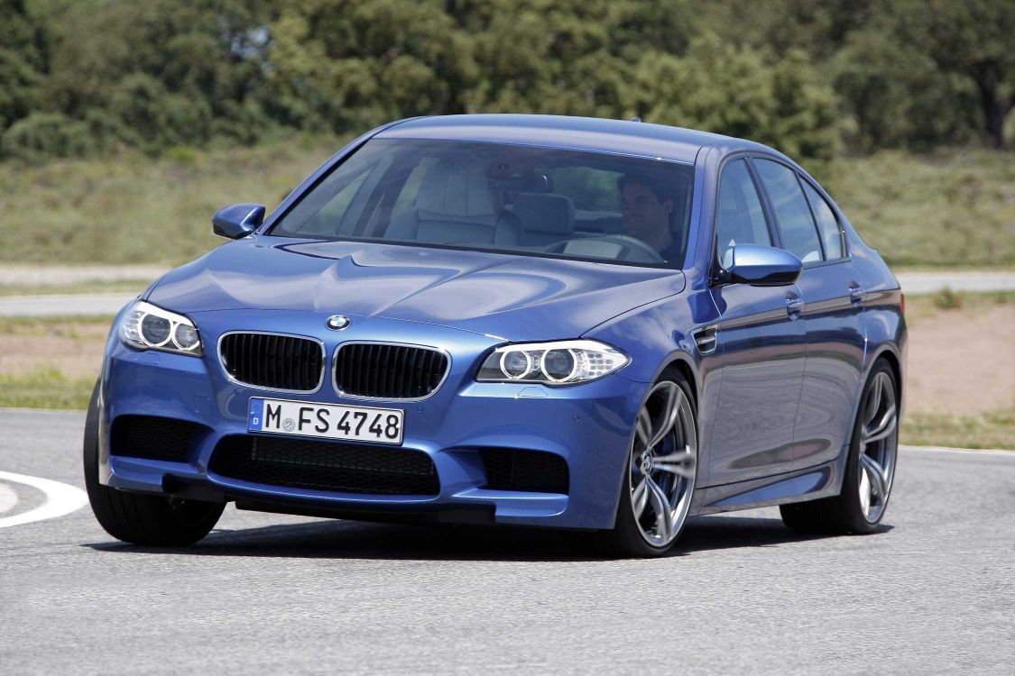 blue bmw m 3 on road during daytime